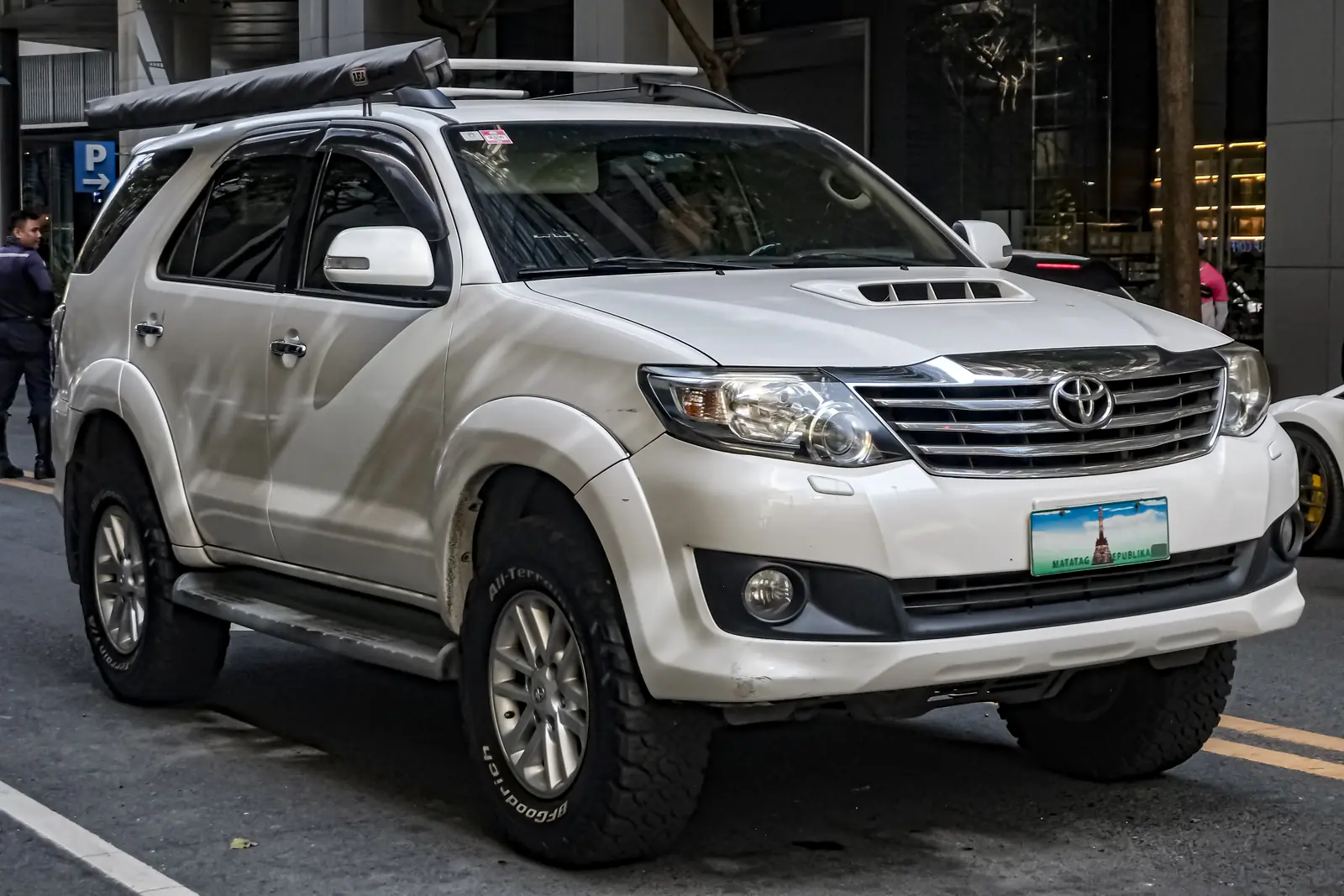 White Toyota Hilux SW4 SUV, front three-quarter view