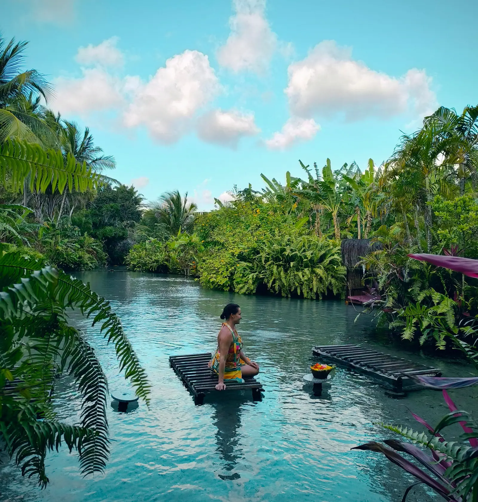 Tao Paradise: a raft on a calm spring-fed river lined with coconut palms